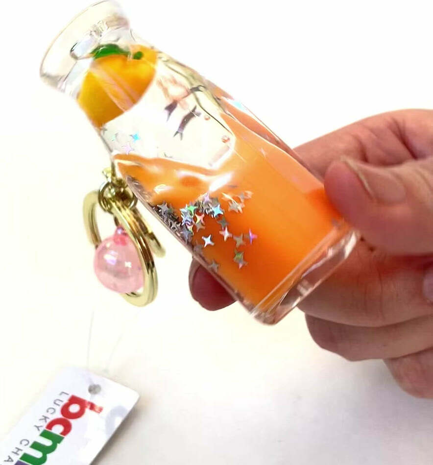 Colorful fruit bottle shaped floating key charm with keyring and clip attachment