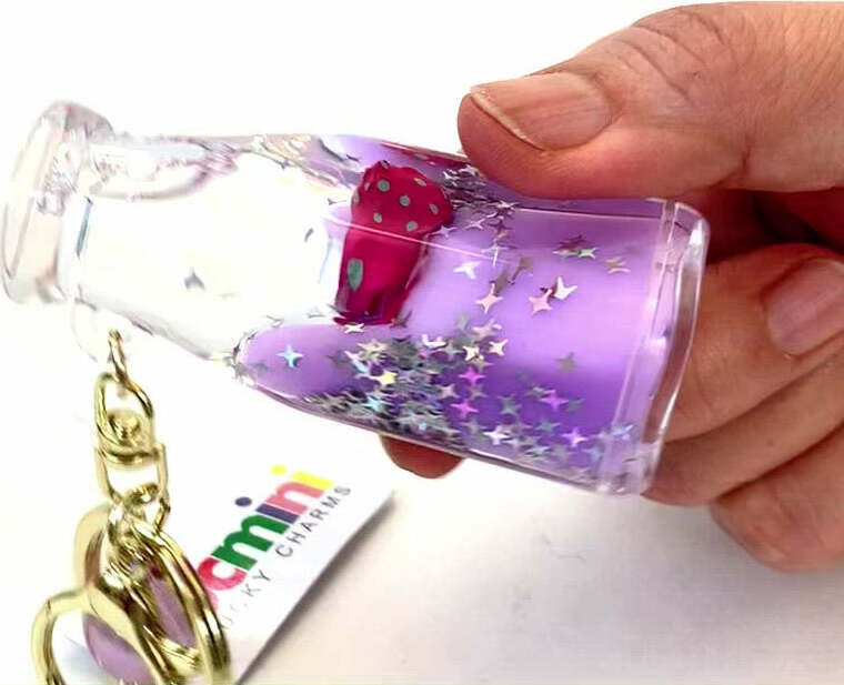 Colorful fruit bottle shaped floating key charm with keyring and clip attachment