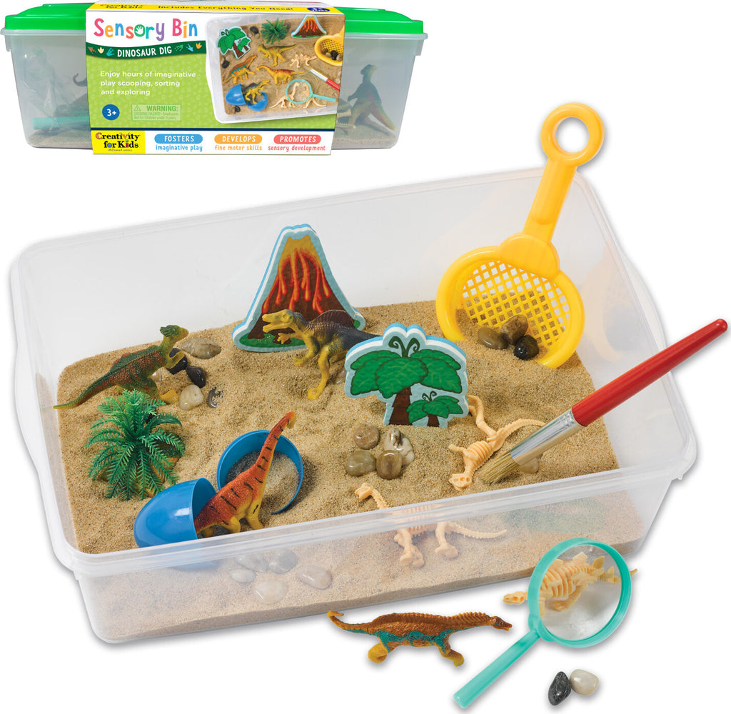 Creativity for Kids Sensory Bin Dinosaur Dig with kinetic sand, dinosaur fossils, and excavation tools