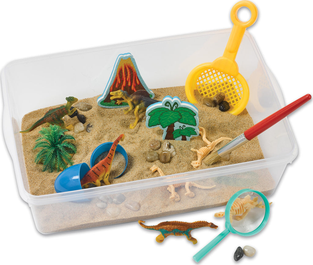 Creativity for Kids Sensory Bin Dinosaur Dig with kinetic sand, dinosaur fossils, and excavation tools