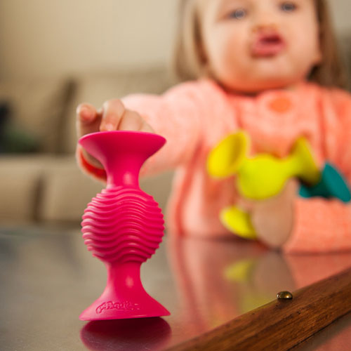 Fat Brain Toys pipSquigz suction cup building set with colorful pieces for creative construction play