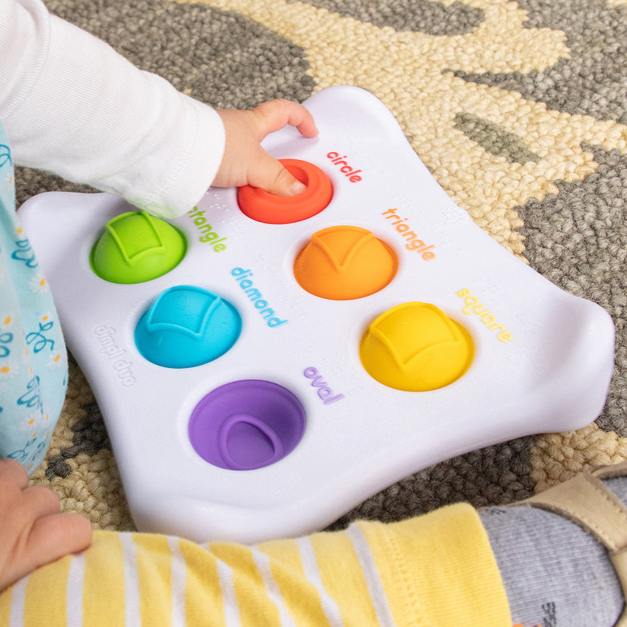 Dimpl Duo sensory toy with colorful silicone buttons for tactile play