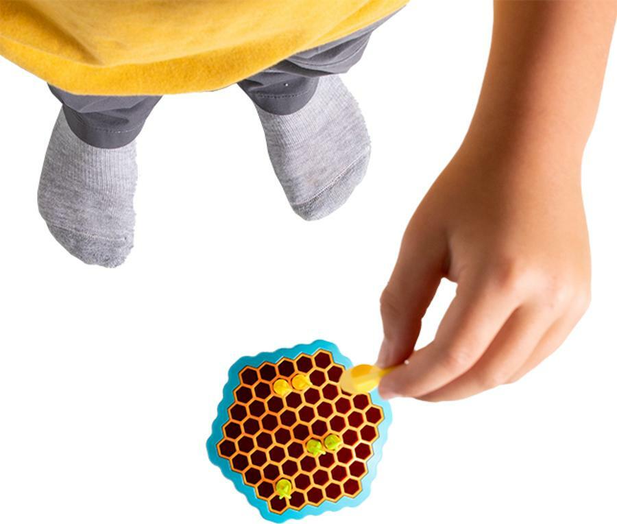 Drop Shot gravity-based skill game by Fat Brain Toys with honeycomb board and colorful arrows for ages 8 and up