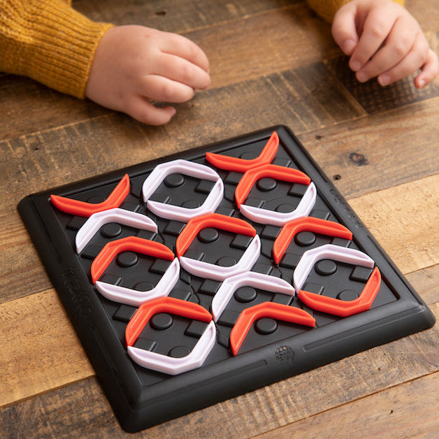 Tic Tac Flip strategy board game with game board and red and white pieces for advanced tic-tac-toe gameplay