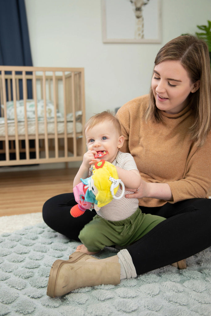 Lamaze My Friend Olivia plush sensory doll with crinkly textures and clip attachment for babies