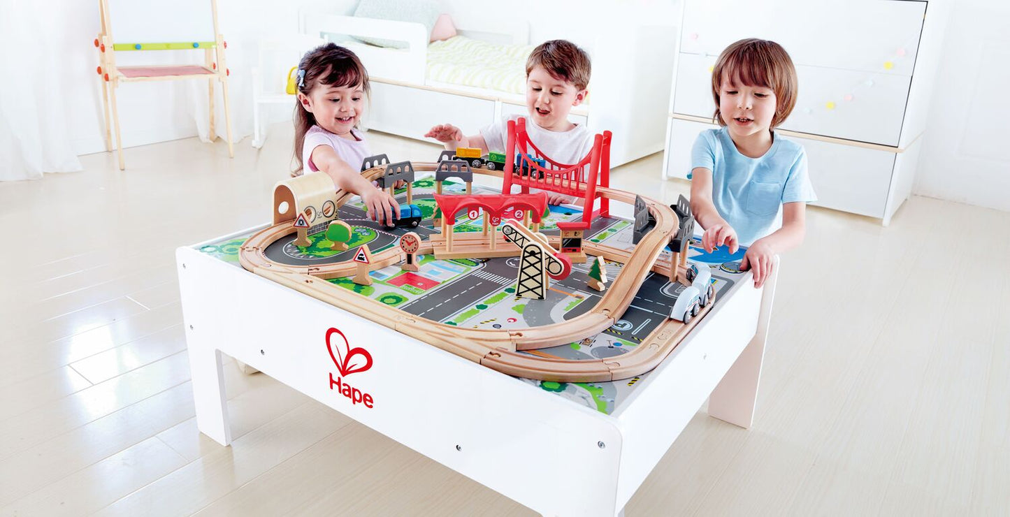 Hape Reversible Train Storage Table with city and countryside scenes, built-in storage for railway toys ages 3-7