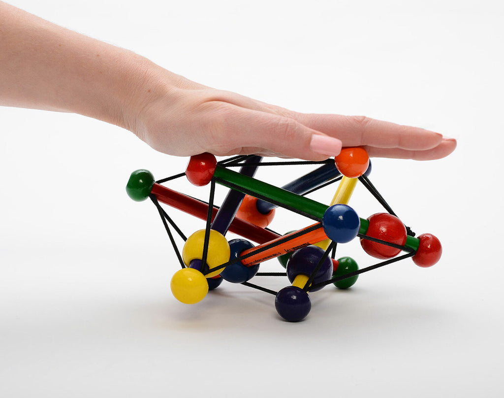 Manhattan Toy Skwish Classic wooden rattle and teether that compresses and returns to original shape with sliding beads