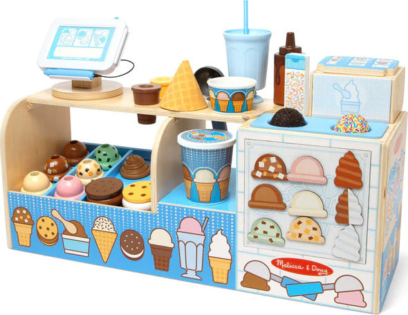 Cool Scoops Ice Creamery pretend play set with wooden counter, ice cream dispenser, scoops, cones, and accessories for children