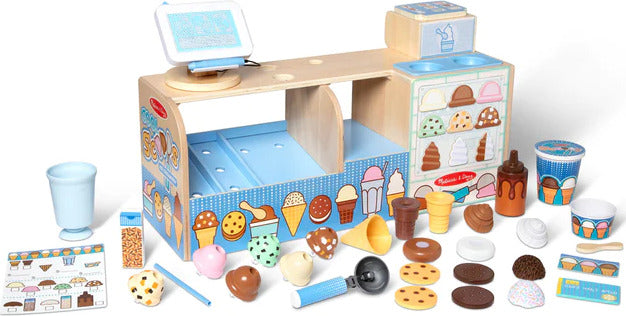Cool Scoops Ice Creamery pretend play set with wooden counter, ice cream dispenser, scoops, cones, and accessories for children