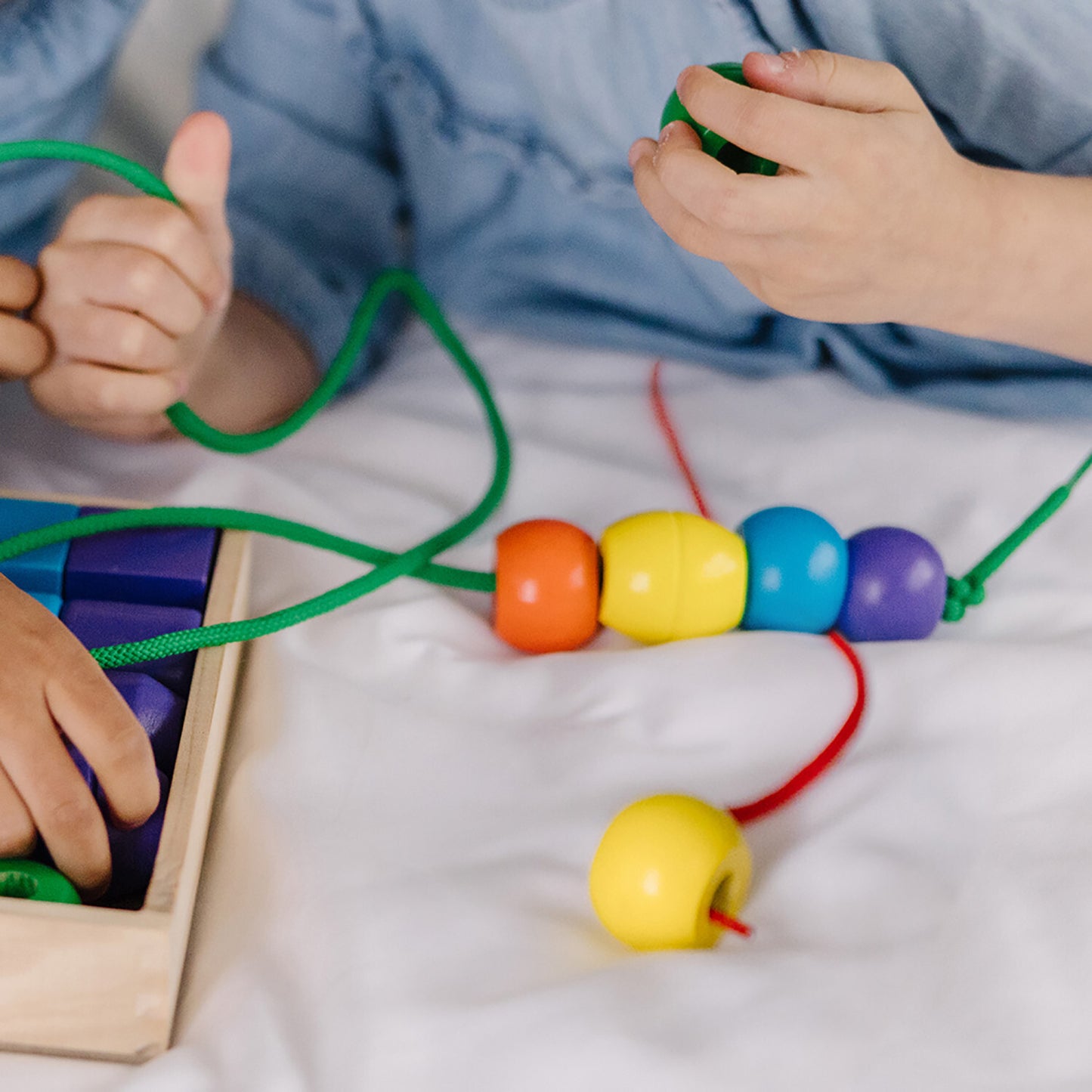 Primary Lacing Beads set with colorful wooden beads and laces for fine motor development