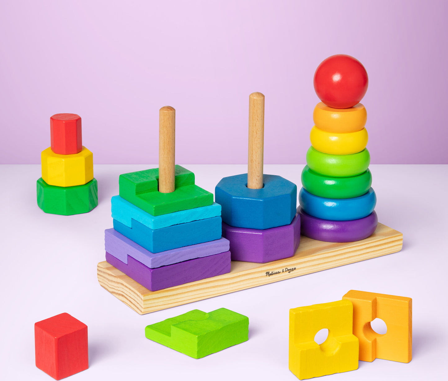 Melissa & Doug geometric stacker with colorful wooden shapes on three rods for learning and sorting