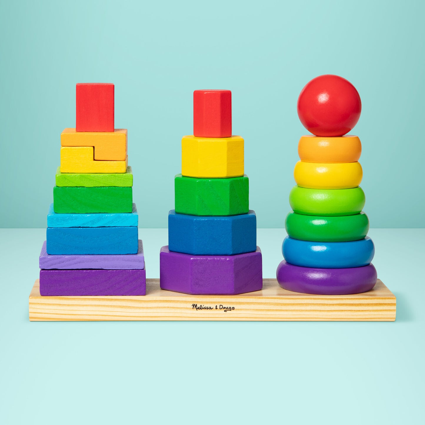 Melissa & Doug geometric stacker with colorful wooden shapes on three rods for learning and sorting