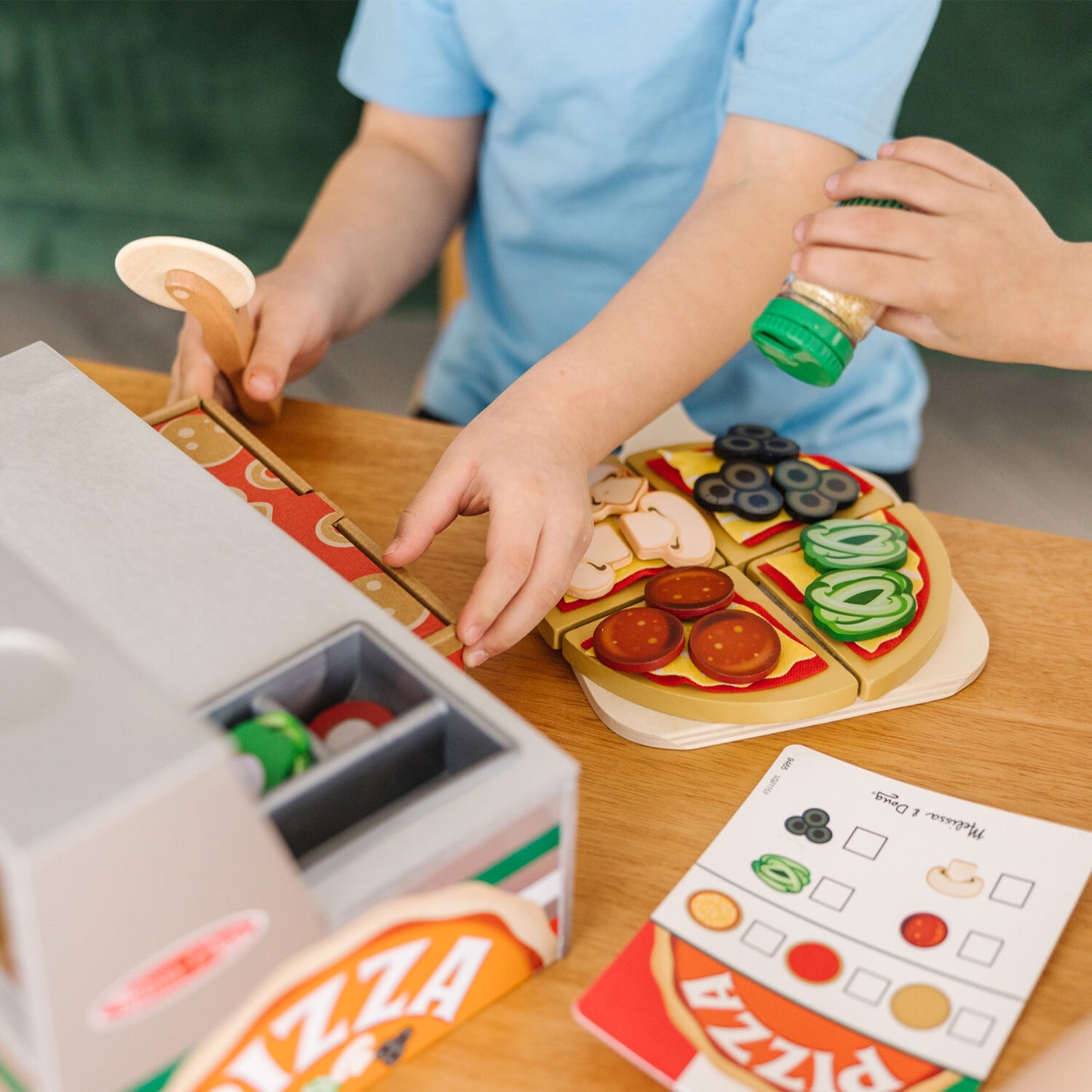 Melissa & Doug Top & Bake Pizza Counter wooden play food set with 34 pieces including pizza oven, toppings, and accessories