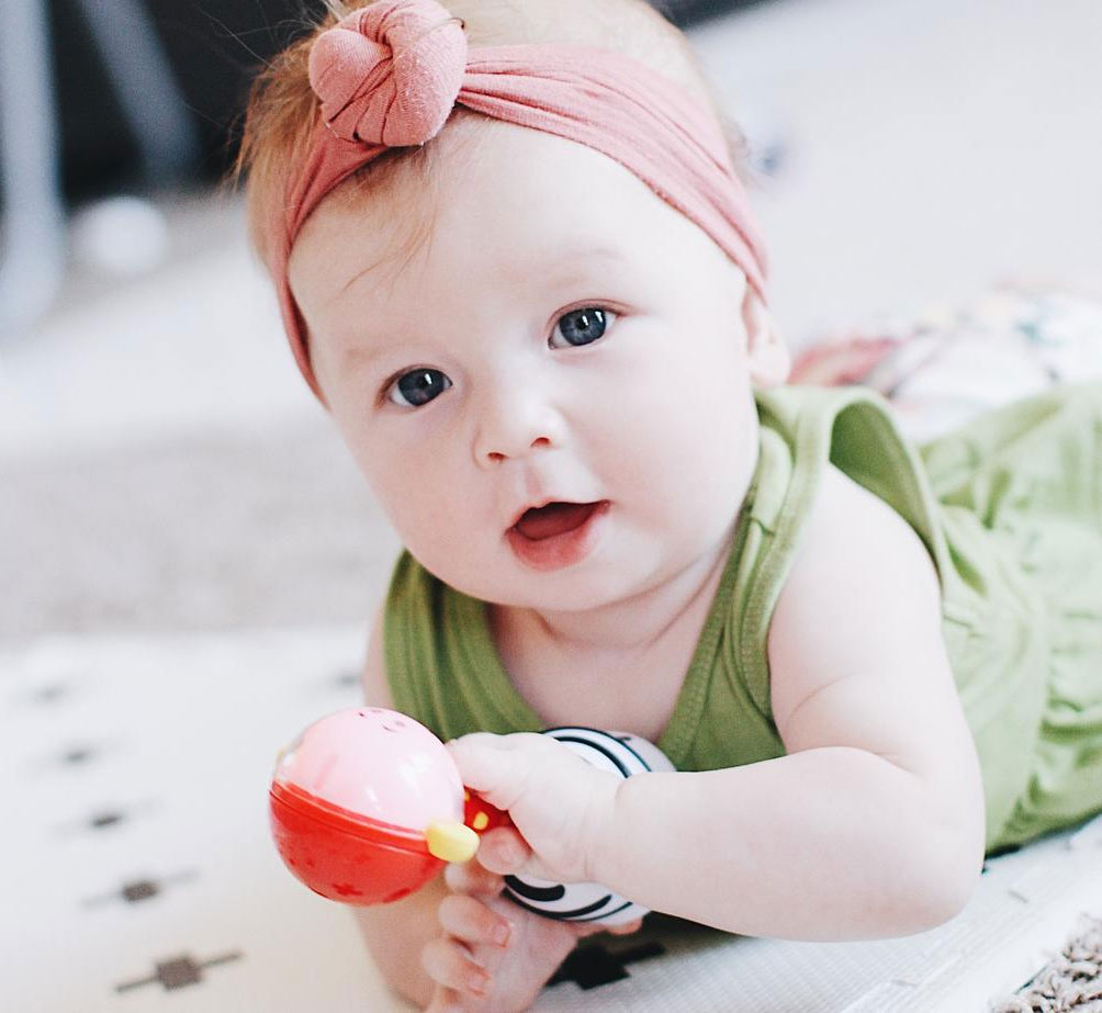 SmartNoggin NogginStik developmental rattle with red, blue, green lights and textures for babies