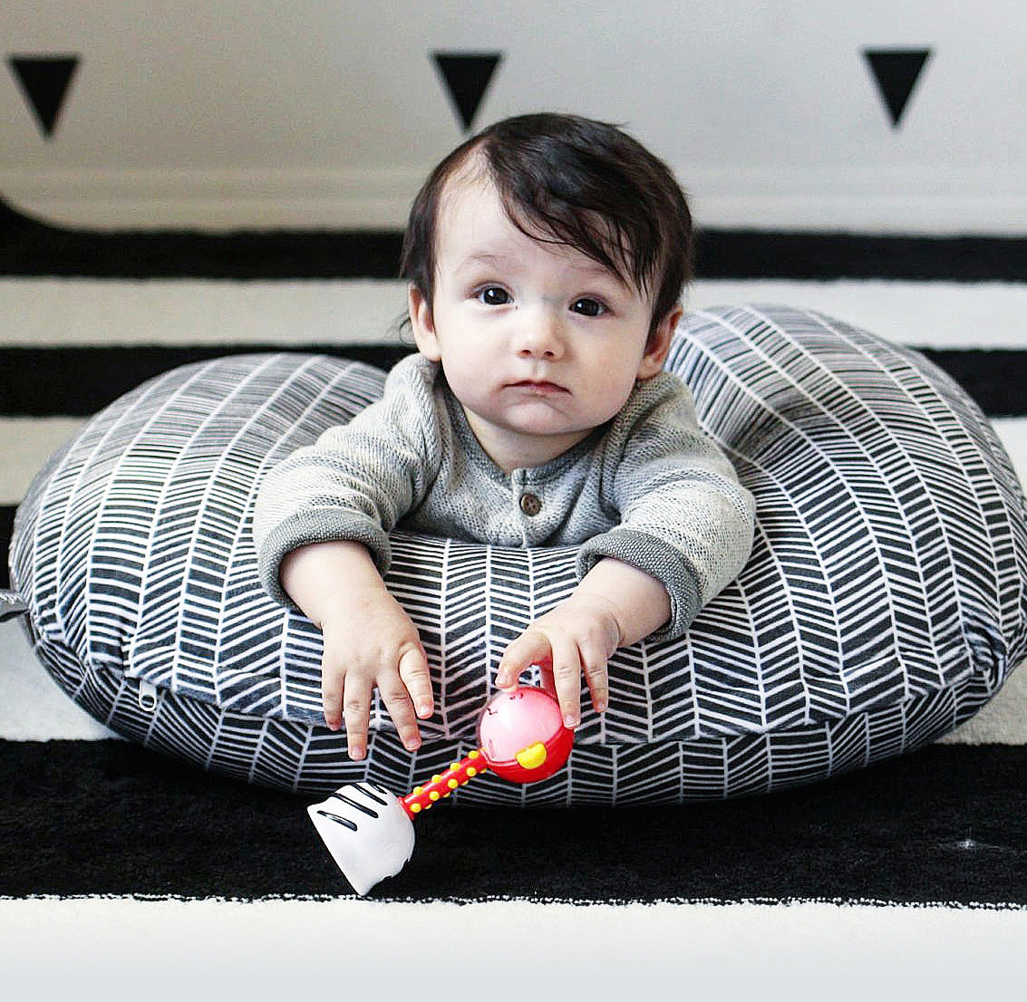 SmartNoggin NogginStik developmental rattle with red, blue, green lights and textures for babies