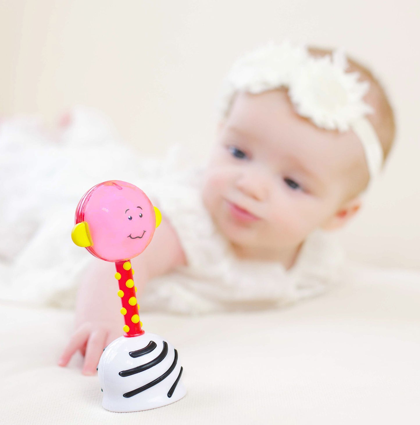 SmartNoggin NogginStik developmental rattle with red, blue, green lights and textures for babies