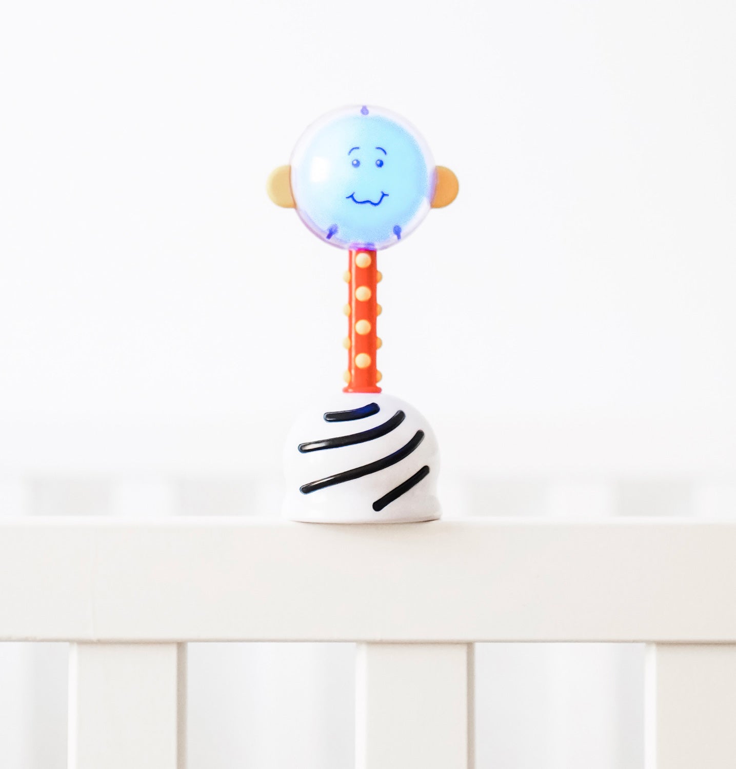 SmartNoggin NogginStik developmental rattle with red, blue, green lights and textures for babies