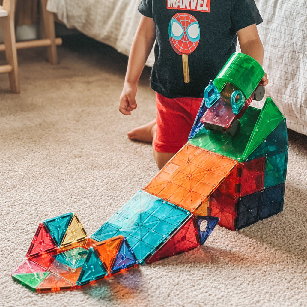 MAGNA-TILES DX 48-Piece Magnetic Construction Set with unique deluxe shapes including arch, hinged door and wheeled chassis