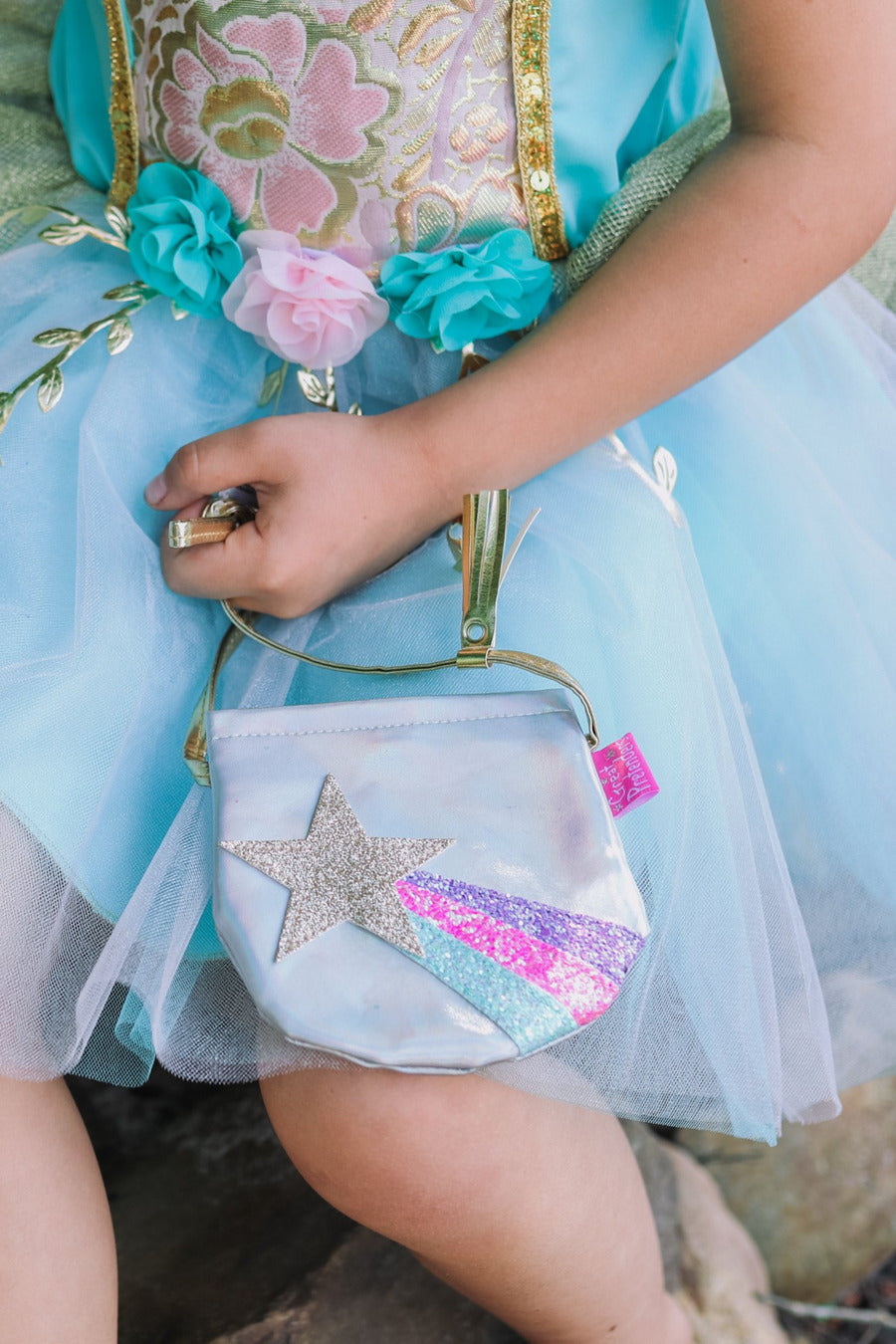 Shining Star petite silver purse with colorful shooting star design, golden shoulder strap with tassel and Velcro closure