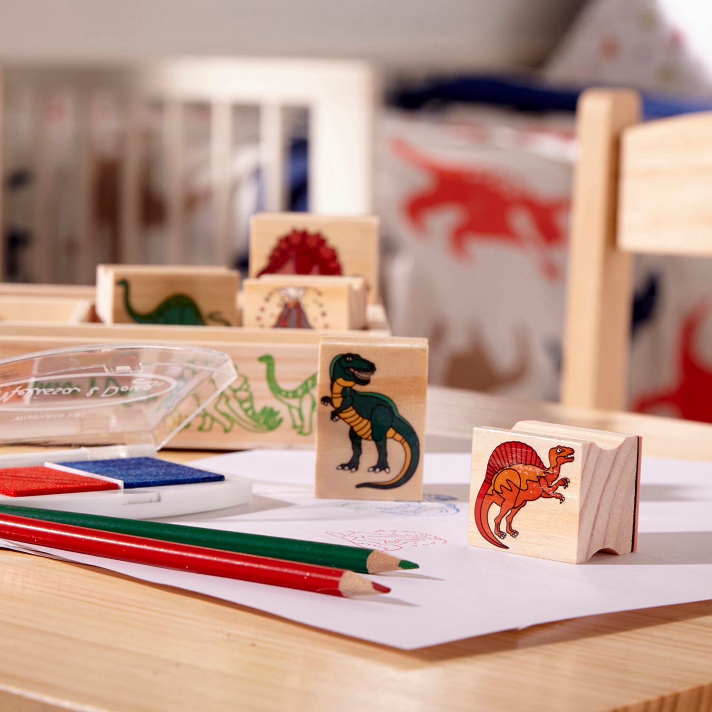 Wooden Stamp Set Dinosaurs with prehistoric creature designs and ink pad for creative stamping activities