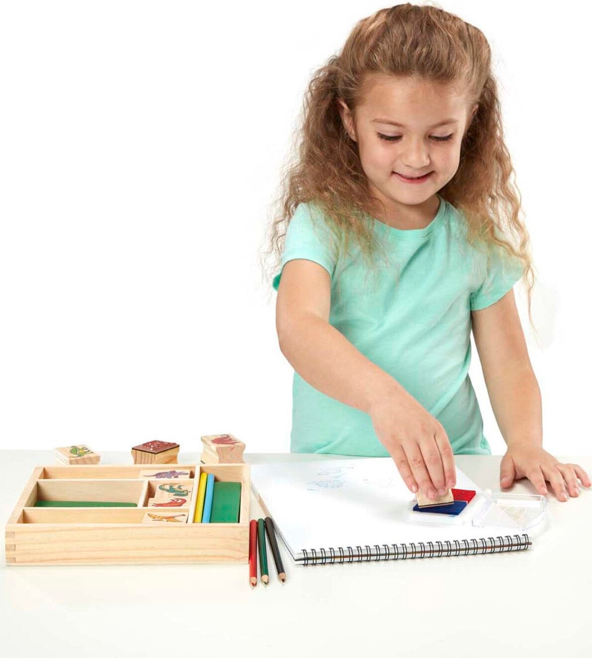 Wooden Stamp Set Dinosaurs with prehistoric creature designs and ink pad for creative stamping activities