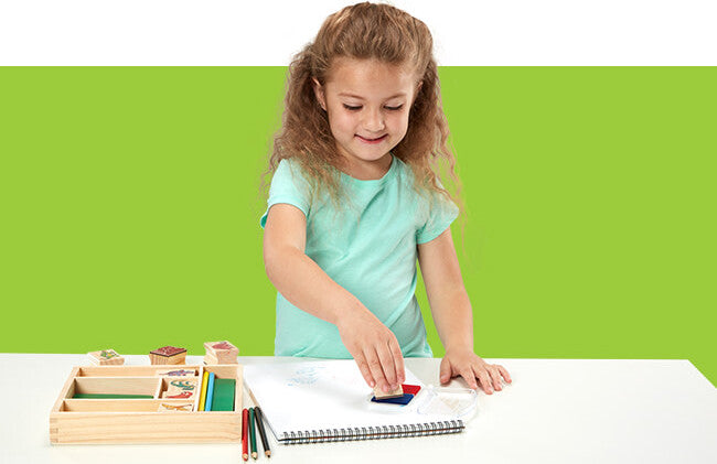 Wooden Stamp Set Dinosaurs with prehistoric creature designs and ink pad for creative stamping activities