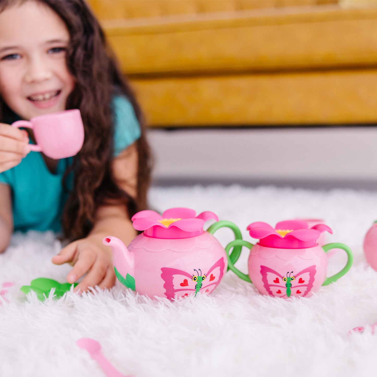 Bella Butterfly Pretend Play Tea Set with 17 pieces in rosy colors and charming butterfly decorations by Melissa & Doug