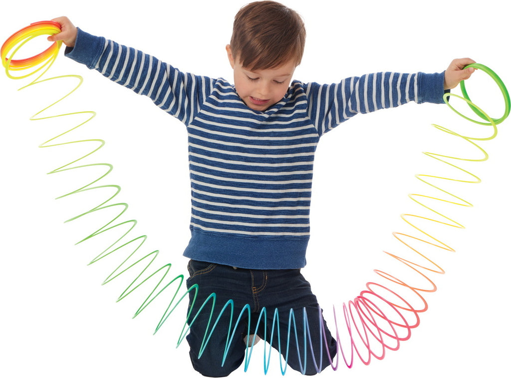 Jumbo rainbow spring toy with colorful plastic coils for stair walking and active play